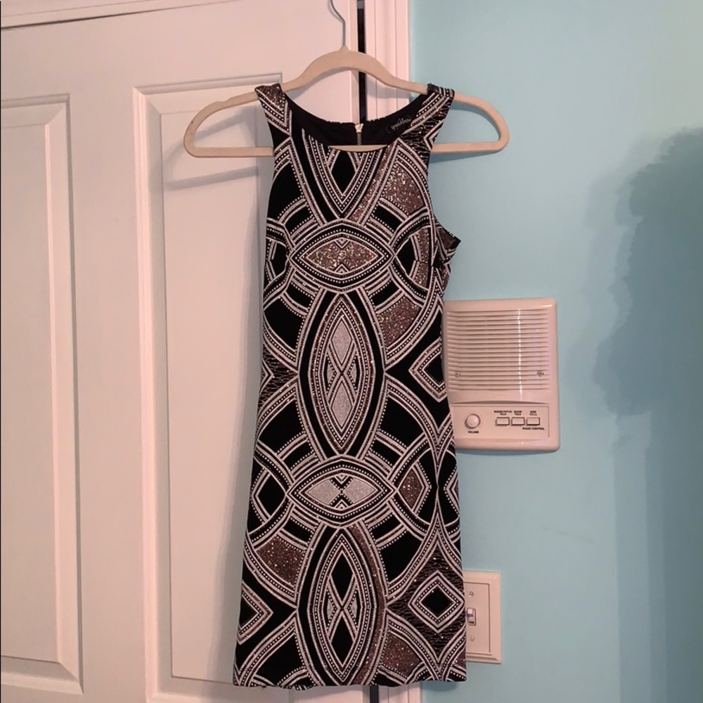 rose gold, white and black tight fitted dress.
